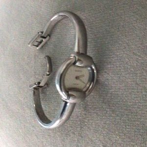 Gucci Petite Stainless Steel Vintage Watch 1400L needs repair to tell time.